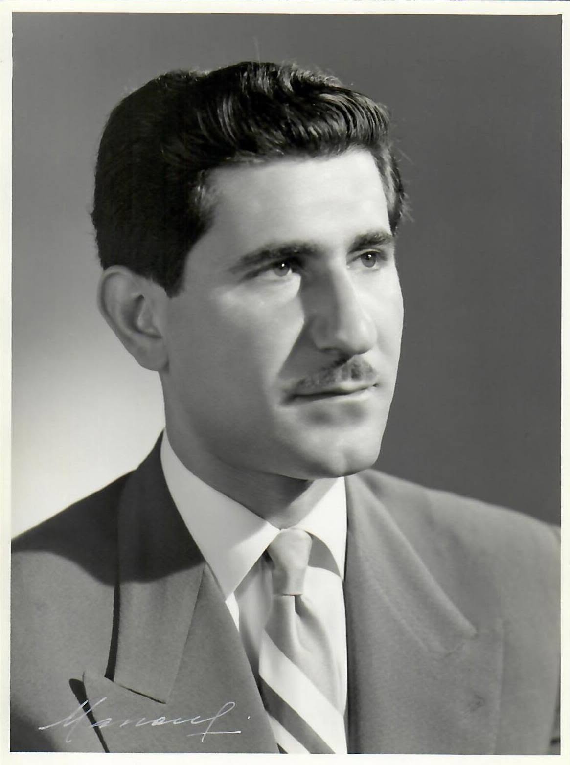 Young Judge Hassan Kawas in a black and white studio portrait